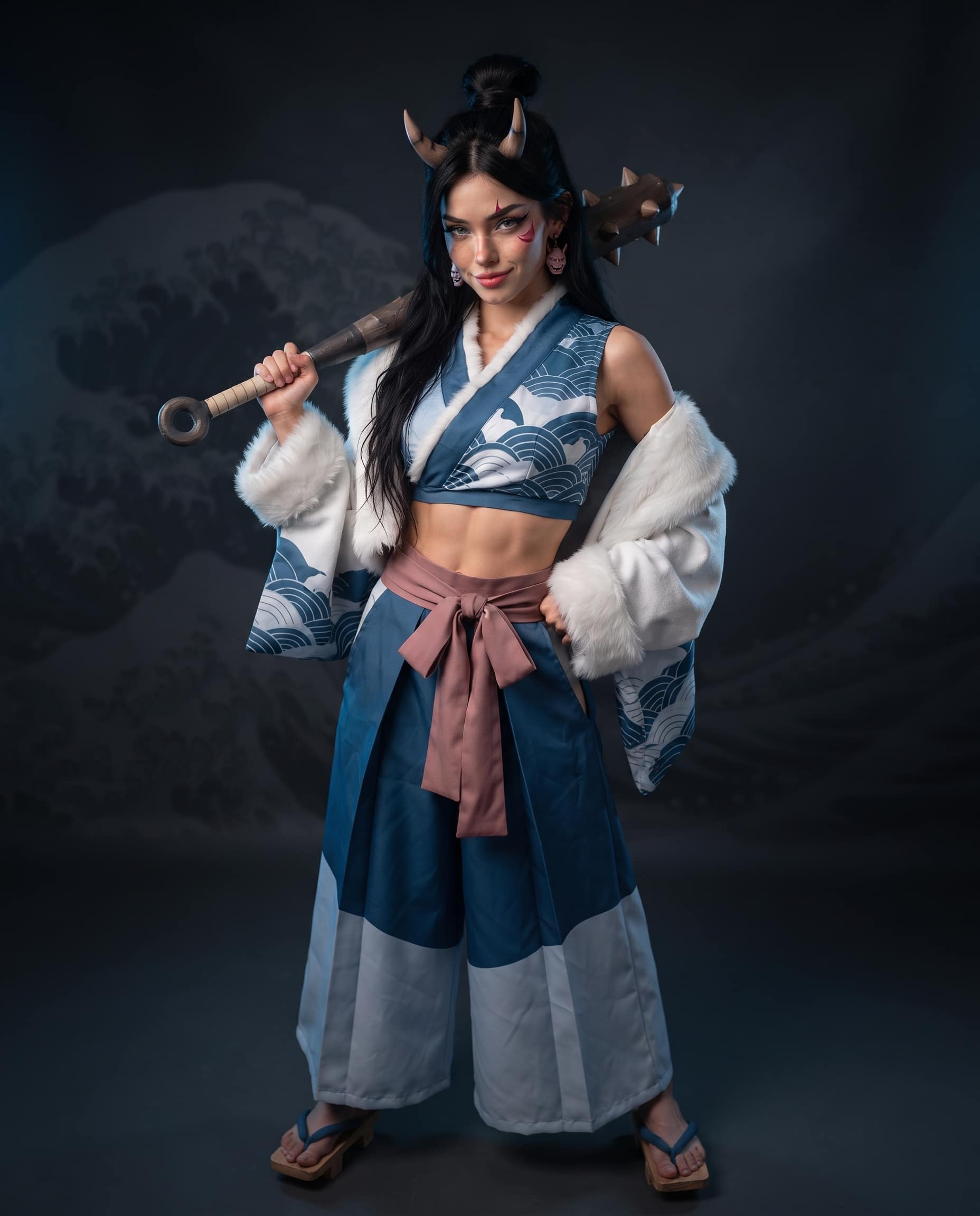 Luna Luxe in an original oni-inspired warrior cosplay with horns, kanabo club, and fur-trimmed kimono